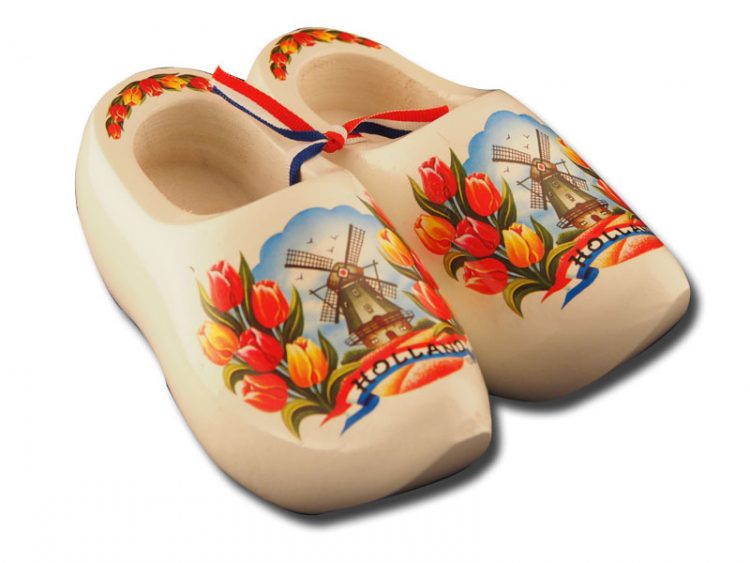 white wooden clogs